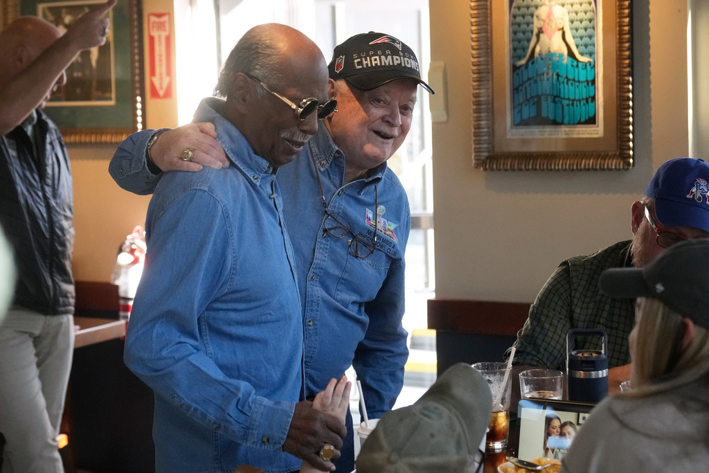 Gregory Eaton, left, and Don Crisman, friends who have attended every Super Bowl football game, gather before a news conference at the Hard Rock Cafe in San Francisco, Friday, Feb. 6, 2026. (AP Photo/Jeff Chiu)