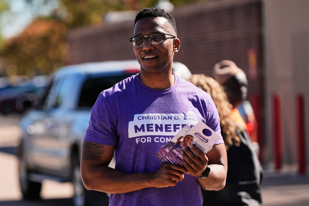 FILE - Democratic 18th Congressional District candidate Christian Menefee greets voters near a polling place on Nov. 4, 2025, in Houston. (AP Photo/Ashley Landis, file)