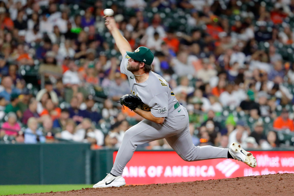 Athletics relief pitcher Mason Barnett throws against the Houston Astros during the fifth inning of a baseball game Friday, June 5, 2026, in Houston. (AP Photo/Michael Wyke)