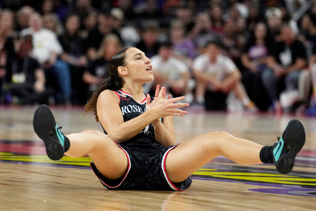 Portland Fire guard Carla Leite celebrates a score and being fouled against the Phoenix Mercury during the first half of a WNBA basketball game Sunday, Aug. 16, 2026, in Phoenix. (AP Photo/Ross D. Franklin)