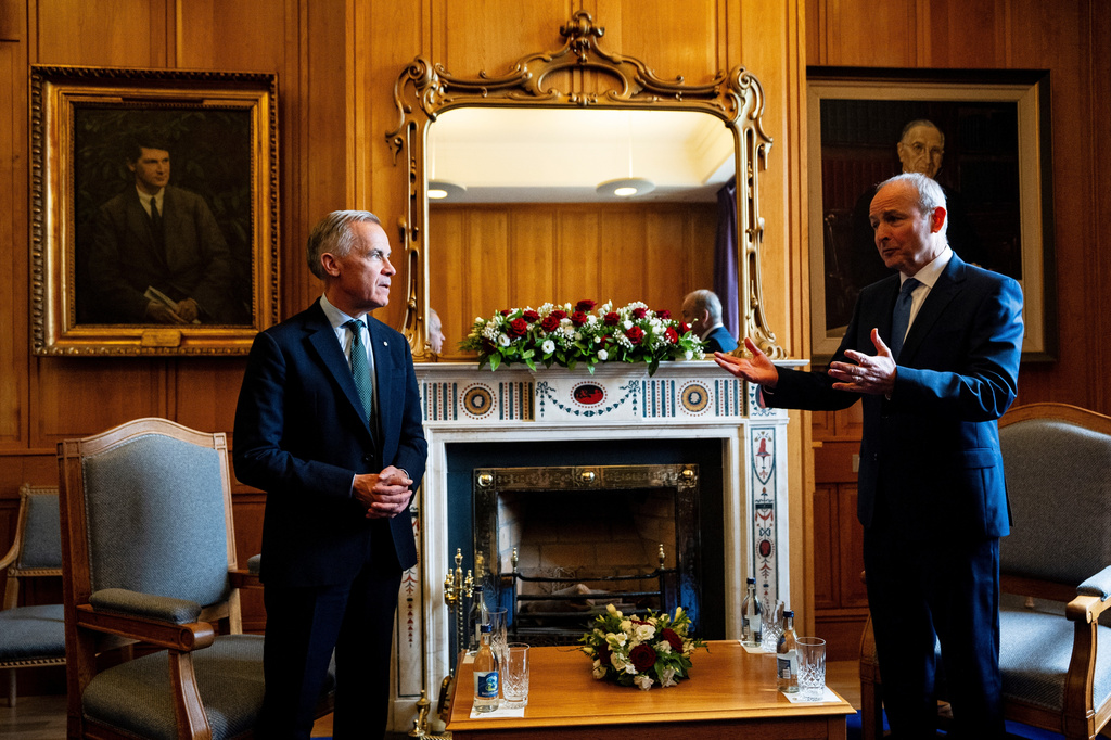 Prime Minister Mark Carney, left, speaks with Micheal Martin, Ireland's head of government, at the Government Buildings in Dublin, on Saturday, June 13, 2026. (Christopher Katsarov /The Canadian Press via AP)