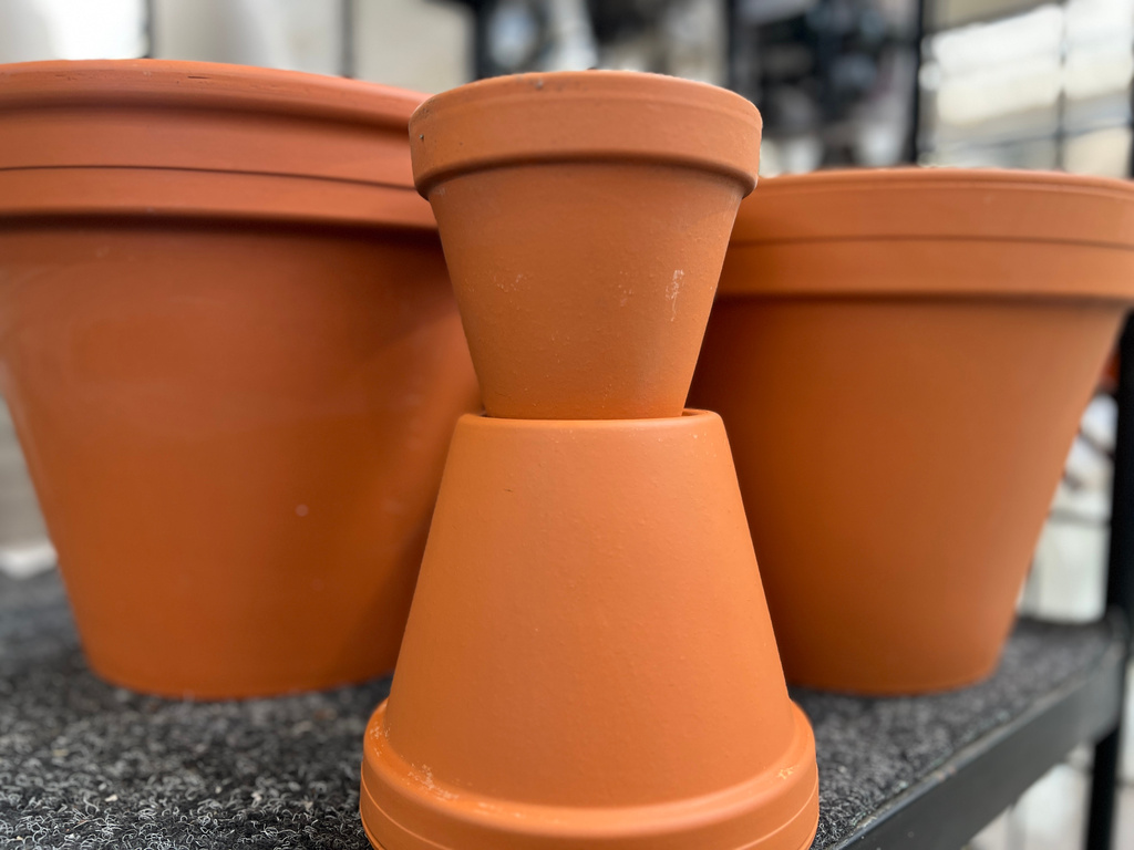 An assortment of plastic-free terracotta planting pots are displayed on Long Island, N. Y., on April 8, 2026. (Jessica Damiano via AP)