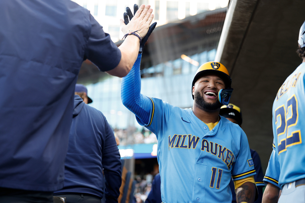 Milwaukee Brewers' Jackson Chourio (11) is greeted by teammates after hitting a two run home run during the first inning of a baseball game against the Athletics, Tuesday, June 9, 2026, in Las Vegas. (AP Photo/Caroline Brehman)