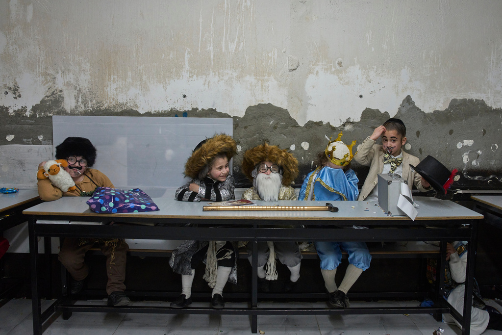 Ultra-Orthodox Jewish children dress up in costumes during school ahead of the Jewish holiday of Purim, in Jerusalem, March 12, 2025. (AP Photo/Ohad Zwigenberg, File)