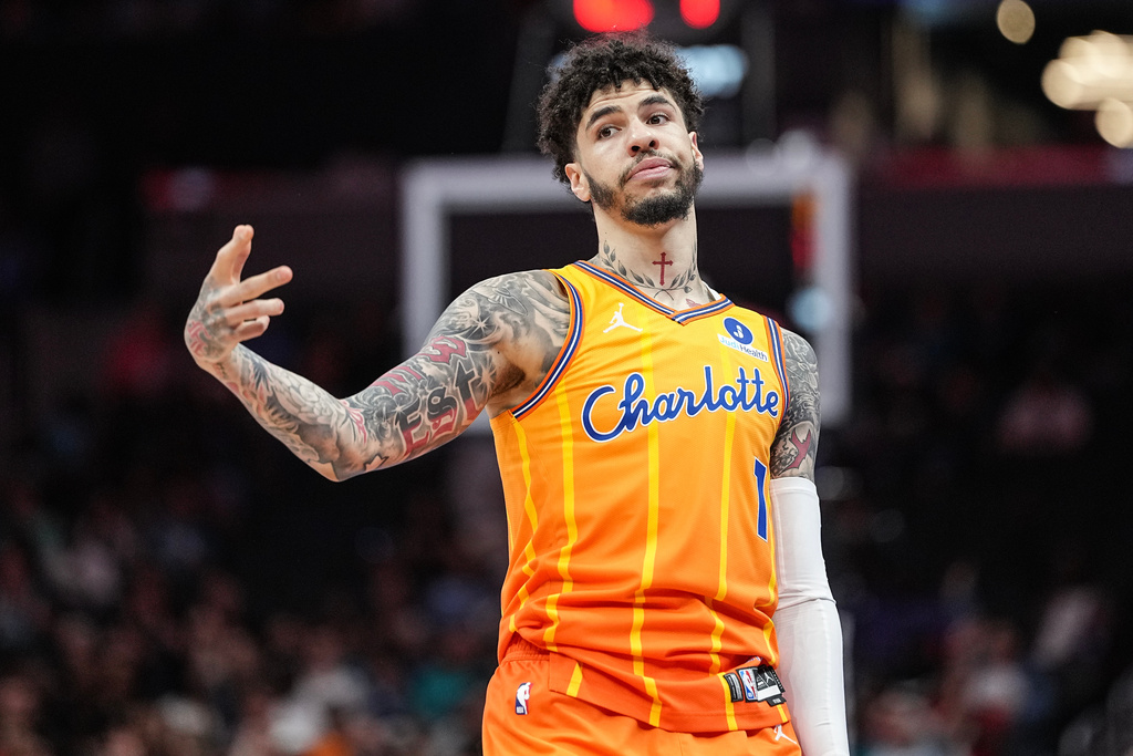 Charlotte Hornets guard LaMelo Ball gestures after making a three-point basket during the first half of an NBA basketball game against the Memphis Grizzlies, Saturday, March 21, 2026, in Charlotte, N.C. (AP Photo/Matt Kelley)