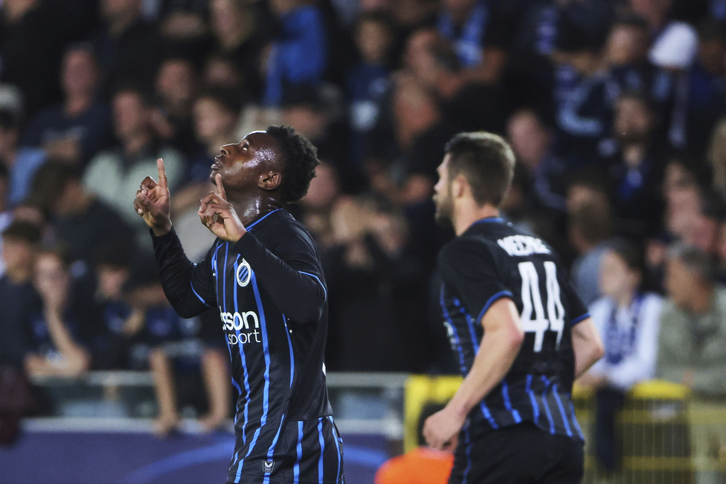Brugge's Mamadou Diakhon, left, celebrates after scoring his sides fourth goal during the Champions League opening phase soccer match between Club Brugge and Monaco at the Jan Breydel Stadium in Bruges, Belgium, Thursday, Sept. 18, 2025. (AP Photo/Omar Havana)