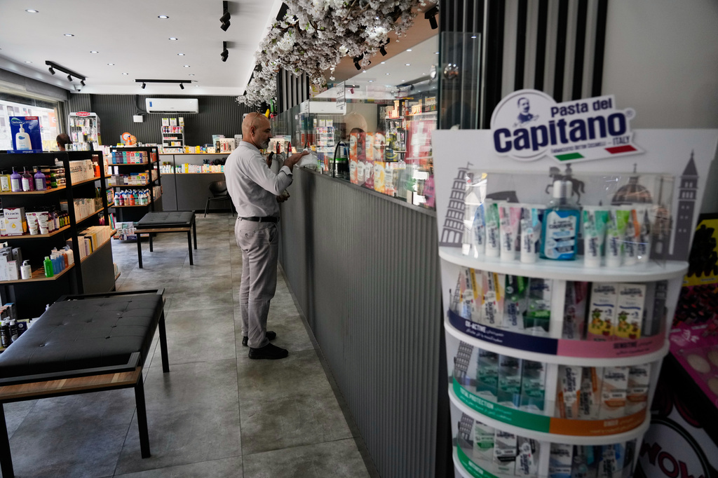 A man receives his medicine in a pharmacy in Tehran, Iran, Saturday, Aug. 29, 2026.(AP Photo/Vahid Salemi)