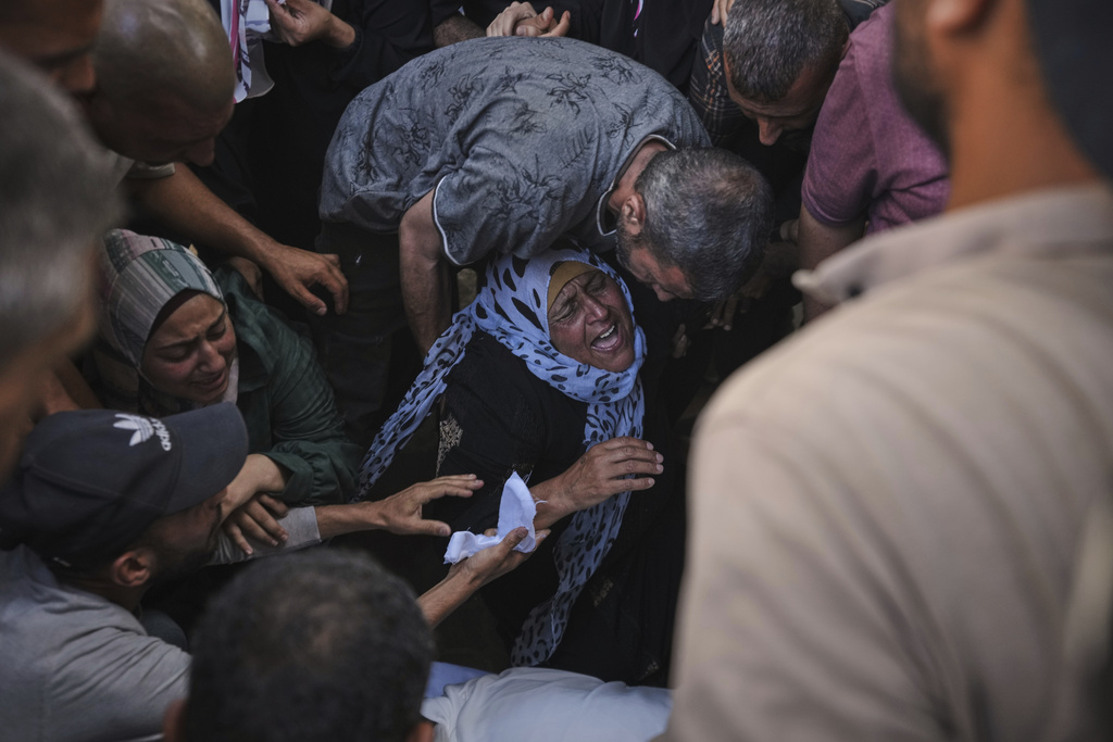 The mother of Anas Al-Basyouni mourns after her son was killed on his way to an aid distribution center, at Shifa Hospital in Gaza City, July 3, 2025. (AP Photo/Jehad Alshrafi)