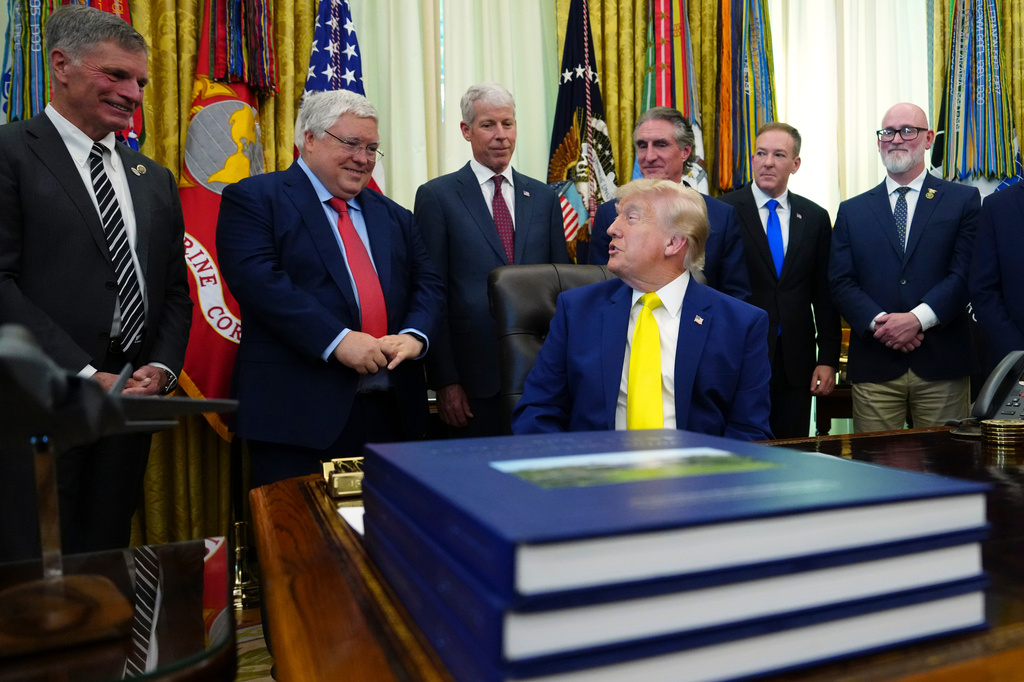 President Donald Trump speaks as Wyoming Gov. Mark Gordon, from left, West Virginia Gov. Patrick Morrisey, Energy Secretary Chris Wright, Interior Secretary Doug Burgum, Environmental Protection Agency administrator Lee Zeldin and Rep. Derrick Van Orden, R-Wis., listen at an event about coal, Thursday, June 4, 2026, in the Oval Office of the White House in Washington. (AP Photo/Julia Demaree Nikhinson)