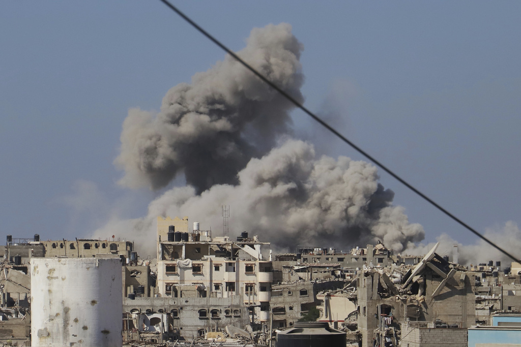 Smoke rises to the sky following an Israeli army airstrike in Khan Younis, in the Gaza Strip, Monday, Aug. 18, 2025. (AP Photo/Mariam Dagga)