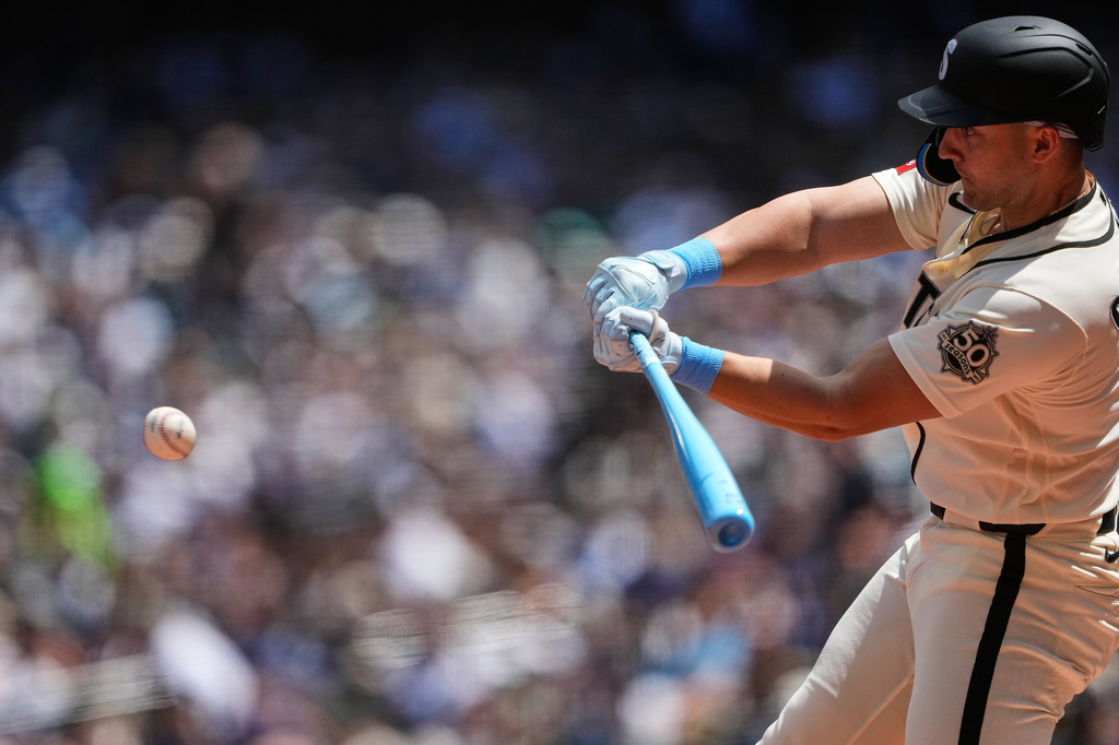 Seattle Mariners' Dominic Canzone hits a solo home run against the Boston Red Sox during the second inning of a baseball game, Sunday, June 21, 2026, in Seattle. (AP Photo/Lindsey Wasson)