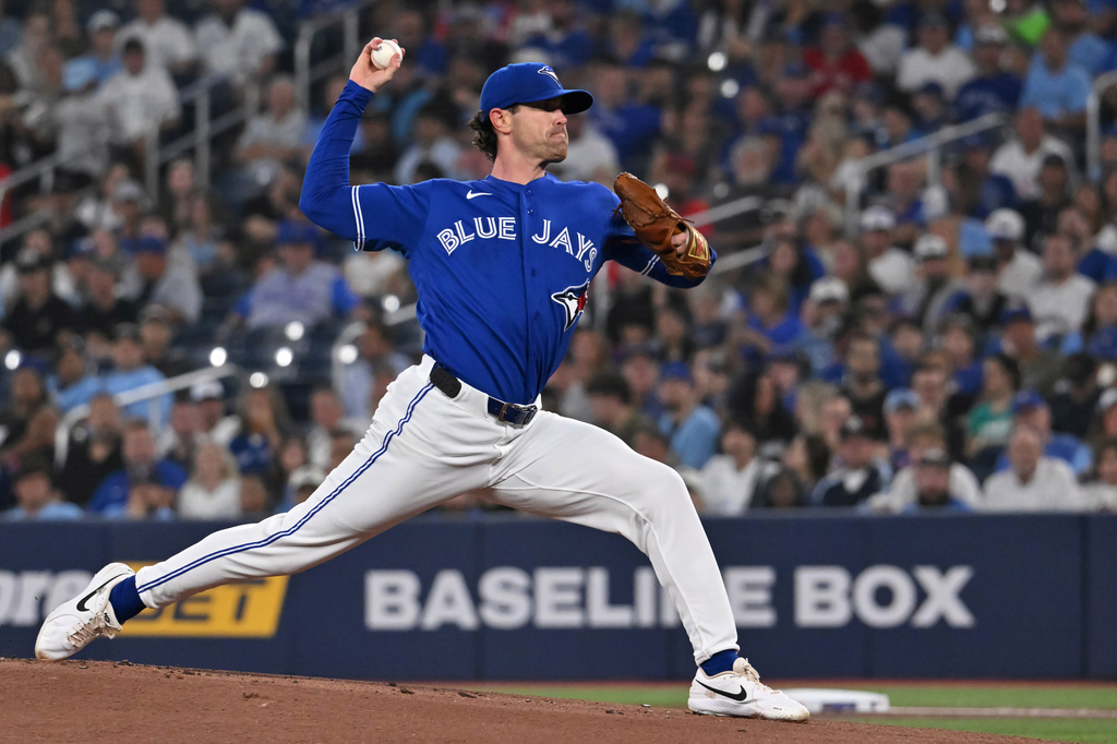 Toronto Blue Jays starting pitcher Shane Bieber (57) throws to a Chicago White Sox batter during first inning of a baseball game in Toronto, Saturday, July 18, 2026. (Jon Blacker/The Canadian Press via AP)