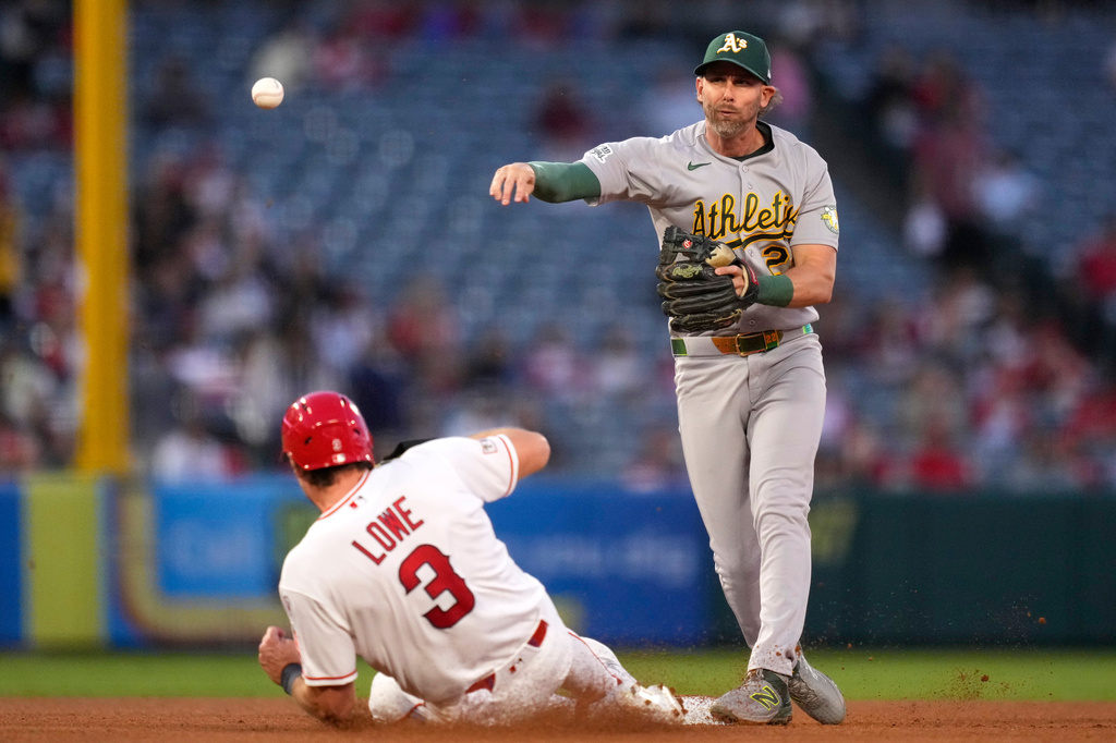 Los Angeles Angels' Josh Lowe, left, is forced out at second as Athletics second baseman Jeff McNeil throws out Jose Siri at first during the fifth inning of a baseball game Thursday, May 21, 2026, in Anaheim, Calif. (AP Photo/Mark J. Terrill)