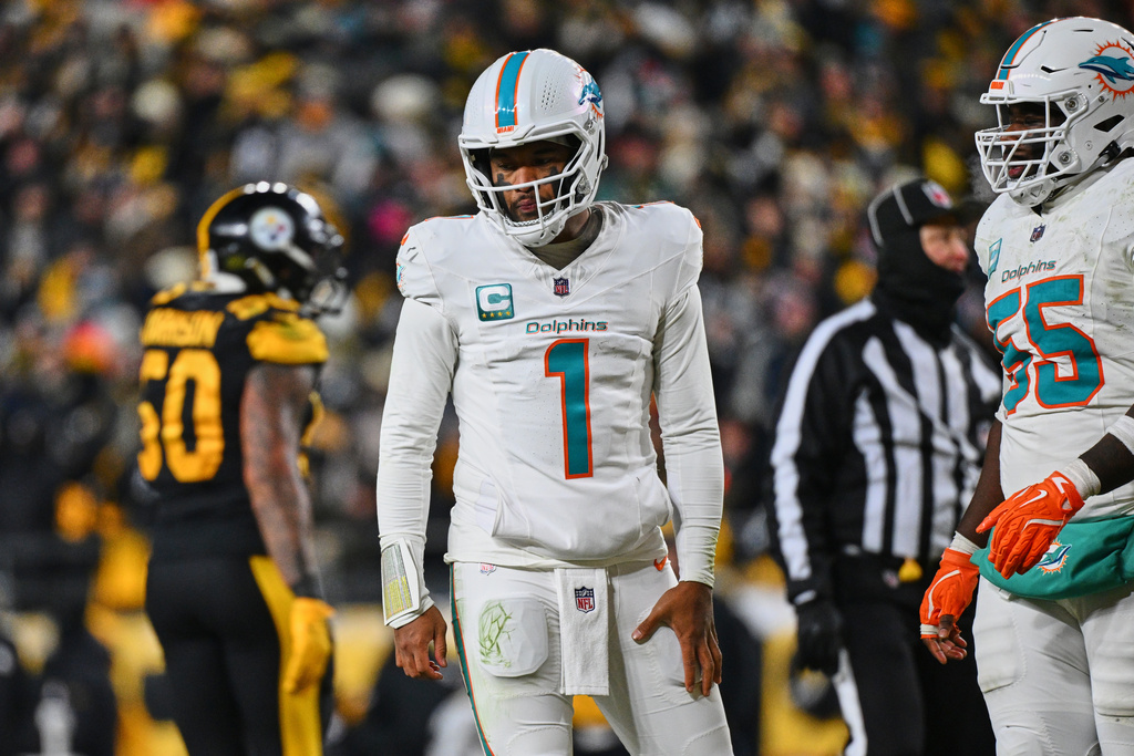 Miami Dolphins' Tua Tagovailoa (1) walks off the field after a failed two-point conversion attempt in the second half of an NFL football game against the Pittsburgh Steelers in Pittsburgh, Monday, Dec. 15, 2025. (AP Photo/Justin Berl)