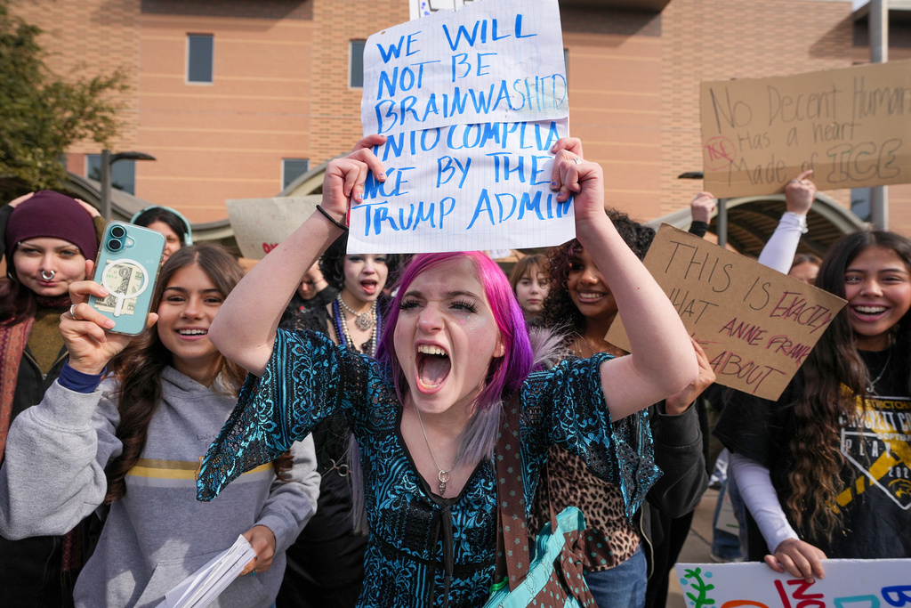 Crockett High School student Alexandra Fulbright, 15, walks out of school in Austin, Texas, on Friday, Jan. 30, 2026, as part of a nationwide protest of the actions of U.S.(Jay Janner /Austin American-Statesman via AP)