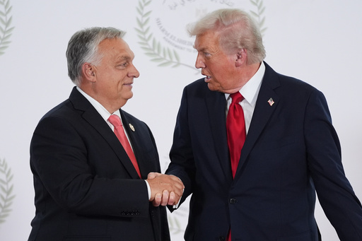 President Donald Trump greets Hungary's Prime Minister Viktor Orban during a summit to support ending the more than two-year Israel-Hamas war in Gaza after a breakthrough ceasefire deal, Monday, Oct. 13, 2025, in Sharm El Sheikh, Egypt. (AP Photo/Evan Vucci, Pool) President Donald Trump greets Hungary's Prime Minister Viktor Orban during a summit to support ending the more than two-year Israel-Hamas war in Gaza after a breakthrough ceasefire deal, Monday, Oct. 13, 2025, in Sharm El Sheikh, Egypt. (AP Photo/Evan Vucci, Pool)