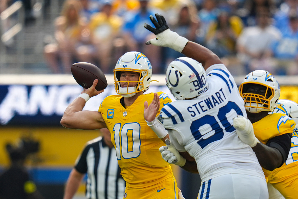 Los Angeles Chargers quarterback Justin Herbert (10) throws against the Indianapolis Colts during the first half of an NFL football game Sunday, Oct. 19, 2025, in Inglewood, Calif. (AP Photo/Gregory Bull)