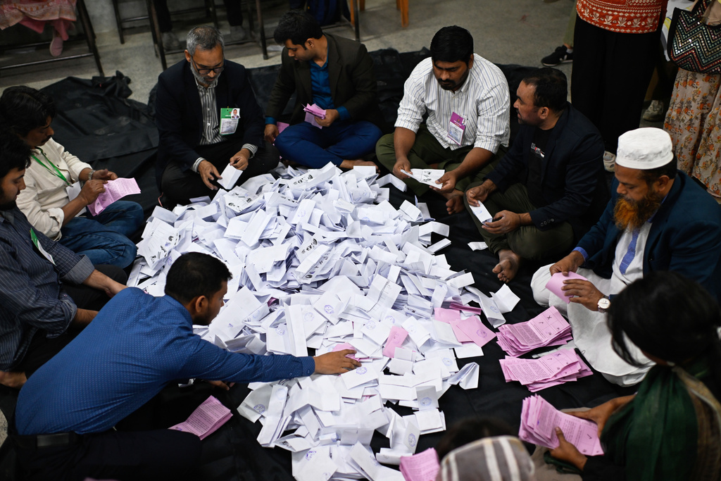 Polling officials begin the counting of votes cast in Bangladesh's national parliamentary election, in Dhaka, Bangladesh, Thursday, Feb. 12, 2026. (AP Photo/Mahmud Hossain Opu)