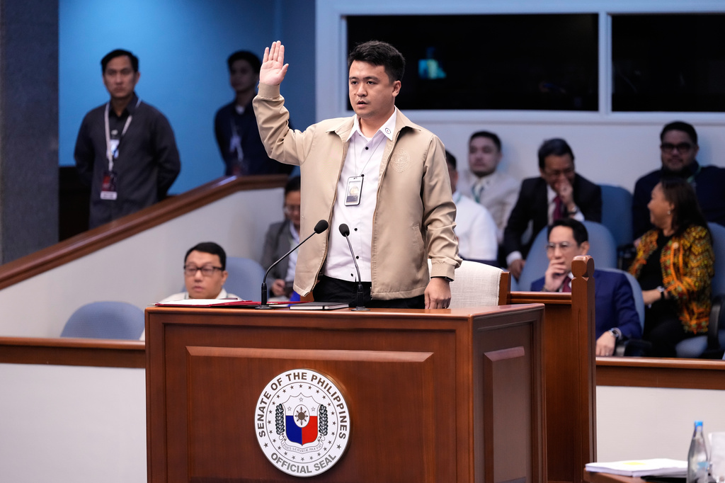 National Bureau of Investigation senior agent John Mark Calilung takes oath as witness during the impeachment trial of Philippine Vice President Sara Duterte at the Philippine Senate in Pasay city, Philippines on Tuesday, July 7, 2026. (AP Photo/Aaron Favila, Pool) ADDITION: Adds this is Pool.