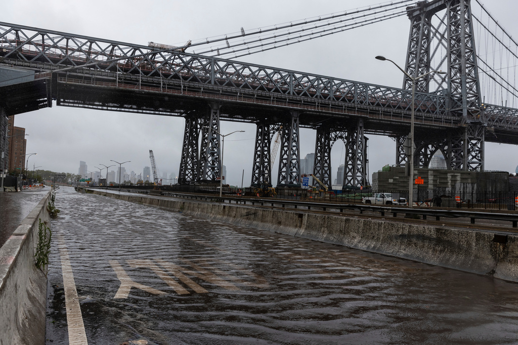 FILE - The FDR highway underneath the Williamsburg Bridge in the Lower East Side of Manhattan is closed due to flooding on Sept. 29, 2023, in New York. (AP Photo/Stefan Jeremiah, File)