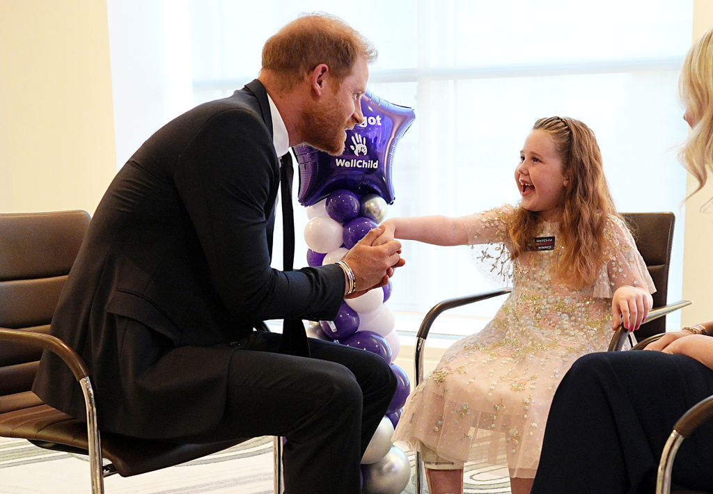 Britain's Prince Harry meets with winner of the Inspirational Child 4-6, Margot Jones-Billington during the WellChild Awards 2026 in London, Monday, Sept. 21, 2026. (Aaron Chown/Pool Photo via AP)