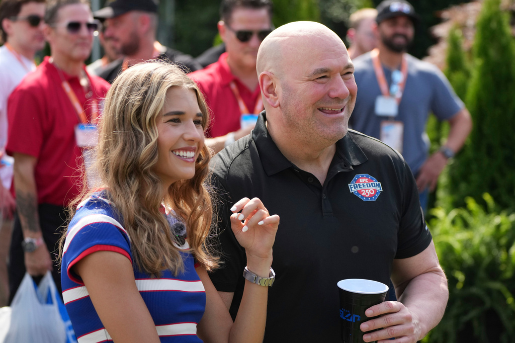 Kai Trump, left, and UFC President and CEO Dana White looks on before a Motorsports athlete and stunt performer does a motorcycle jump ahead of the UFC Freedom 250 fights on the South Lawn of the White House, Saturday, June 13, 2026, in Washington. (AP Photo/Alex Brandon, Pool)