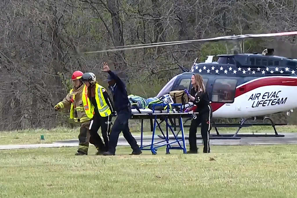 This image taken from video shows emergency responders at the scene of a fatal school bus crash on Friday, March 27, 2026, in Carroll County, Tennessee. (WBBJ-TV via AP)