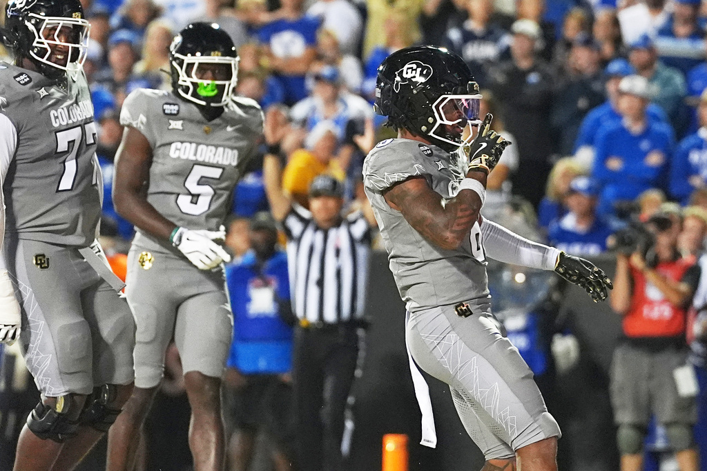 Colorado wide receiver Dre'lon Miller celebrates after running for a touchdown against Brigham Young in the first half of an NCAA college football game Saturday, Sept. 27, 2025, in Boulder, Colo. (AP Photo/David Zalubowski)
