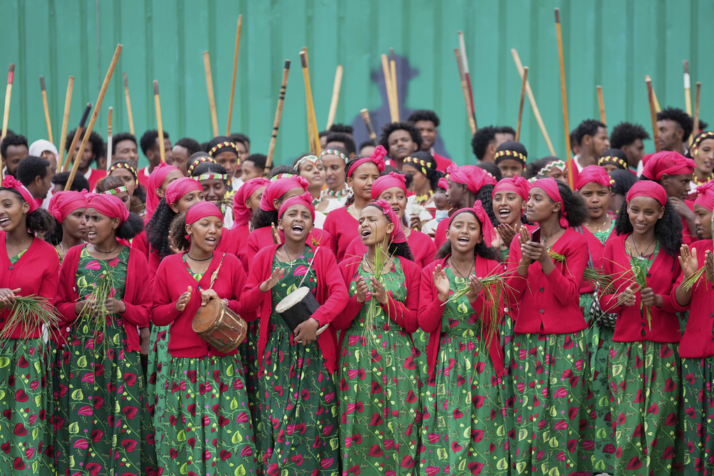 Ethiopian women wearing traditional clothes sing on the street as the Grand Ethiopian Renaissance Dam is inaugurated in Addis Ababa, Ethiopia, Tuesday, Sept. 9, 2025. (AP Photo/Brian Inganga)