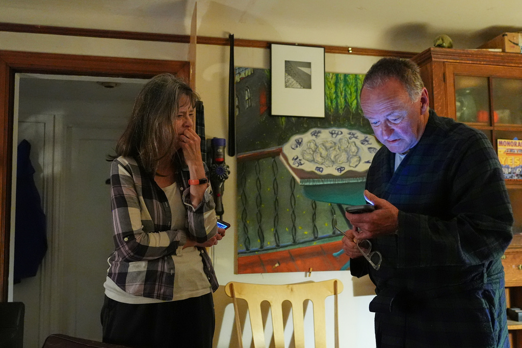 Mary E. Brunkow becomes emotional as her husband Ross Colquhoun speaks with her about her winning the Nobel Prize in medicine for part of her work on peripheral immune tolerance, in Seattle, Monday, Oct. 6, 2025. (AP Photo/Lindsey Wasson)