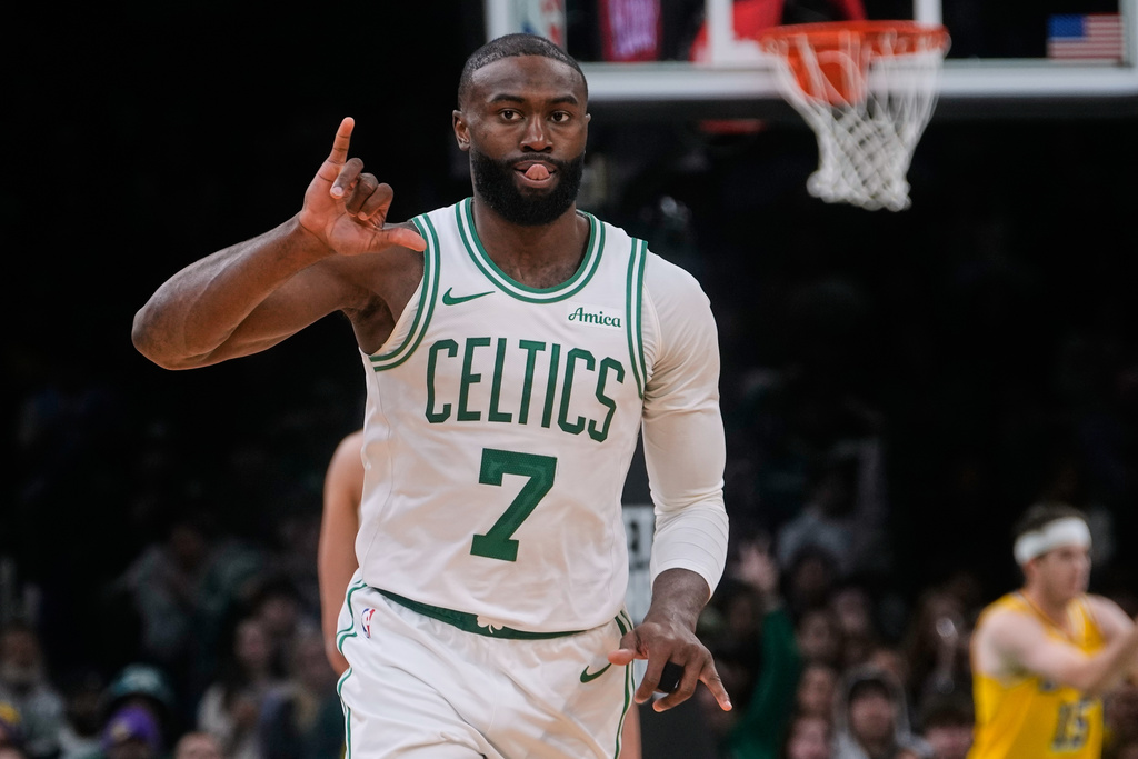 Boston Celtics guard Jaylen Brown celebrates after making a 3-point basket during the second half of an NBA basketball game against the Los Angeles Lakers, Friday, Dec. 5, 2025, in Boston. (AP Photo/Charles Krupa)