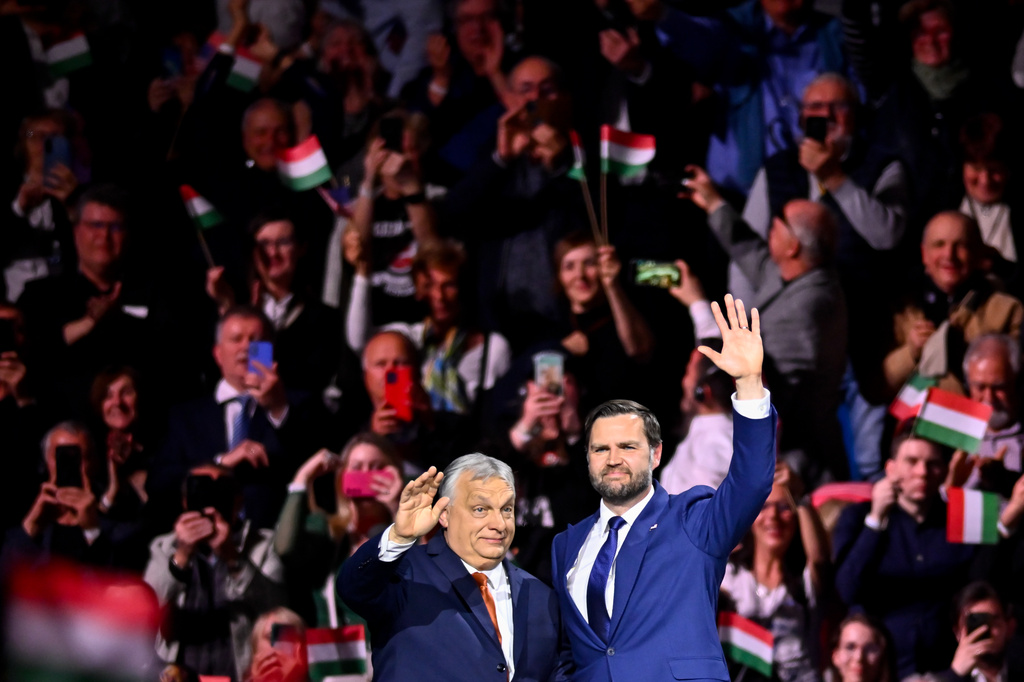 Hungary's Prime Minister Viktor Orban, left, and U.S. Vice President JD Vance wave to the audience at the end of a pre-election rally in Budapest, Hungary, Tuesday, April 7, 2026. (AP Photo/Denes Erdos)