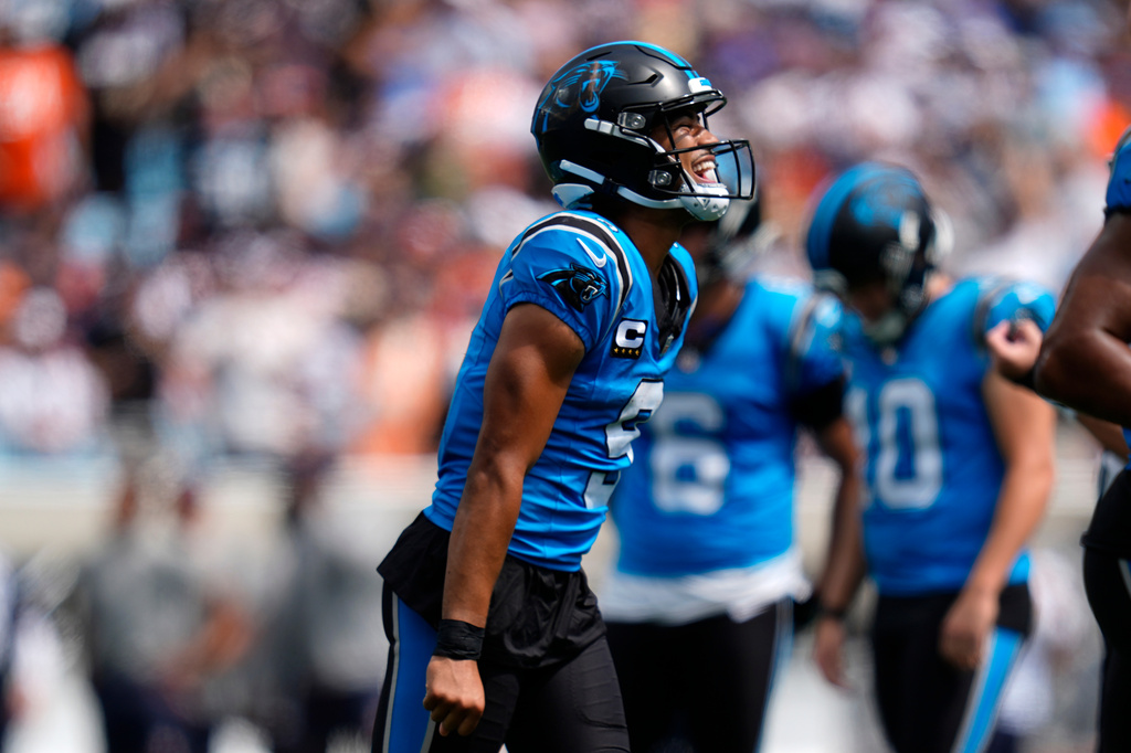 Carolina Panthers quarterback Bryce Young (9) celebrates after scoring a touchdown during the first half of an NFL football game, Sunday, Sept. 13, 2026, in Charlotte, N.C. (AP Photo/Erik Verduzco)