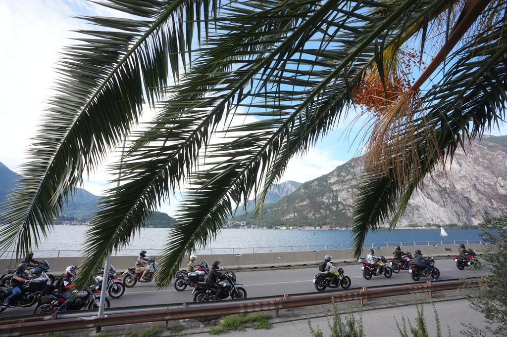Guzzi bikers run during the Grand Parade along the route from Lecco to Mandello del Lario on Lake Como, part of the Moto Guzzi World Days 2026, as the maker celebrates its 105th anniversary, in Lecco, Italy, Saturday, Sept. 5, 2026. (AP Photo/Luca Bruno)