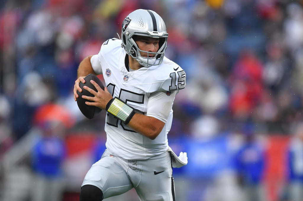 Las Vegas Raiders quarterback Fernando Mendoza runs with the ball during the second half of an NFL football game against the New England Patriots in Foxborough, Mass., Sunday, Oct. 11, 2026. (AP Photo/Steven Senne)