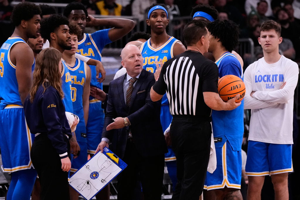 UCLA head coach Mick Cronin, center left, reacts to a call during the first half of an NCAA college basketball game against Michigan State in the quarterfinals of the Big 10 Conference tournament, Friday, March 13, 2026, in Chicago. (AP Photo/Nam Y. Huh)