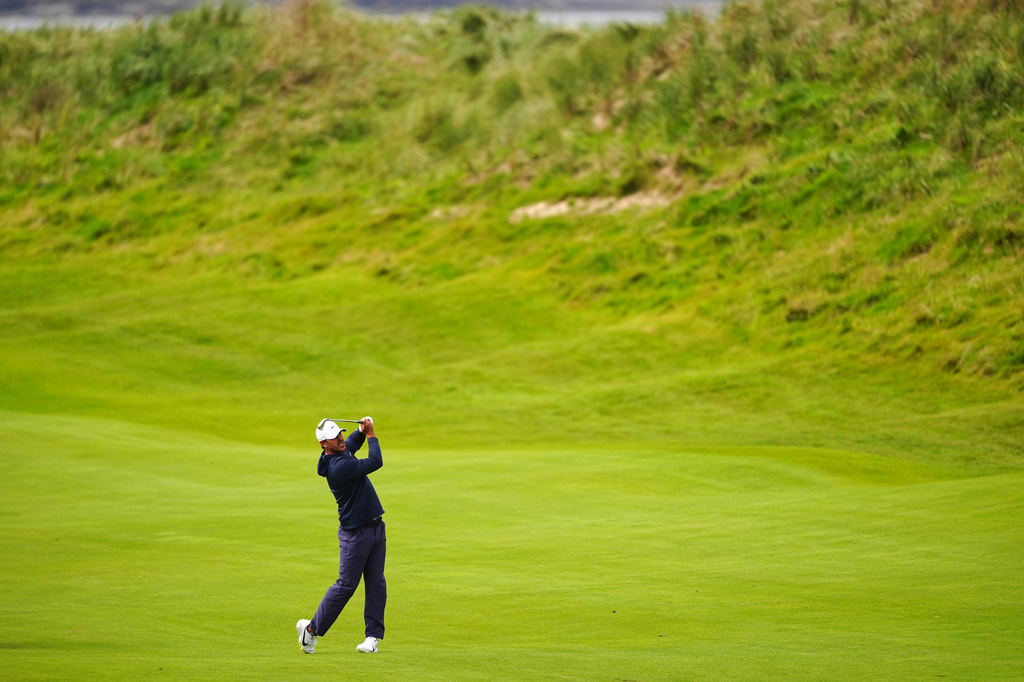 Brooks Koepka, of the United States, plays from the first fairway during the first round of the Irish Open golf tournament, Thursday, Sept. 10, 2026, in Doonbeg, Ireland. (Brian Lawless/PA via AP)