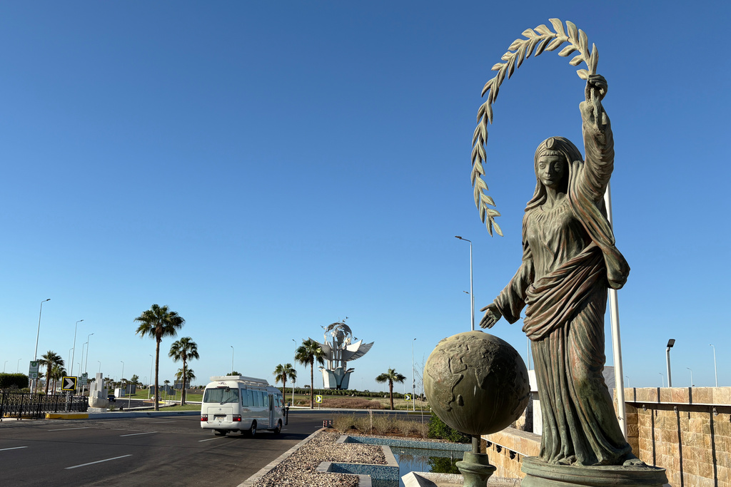 A vehicle passes at Peace Square at the Red Sea city of Sharm el-Sheikh, Egypt, where Israeli and Hamas officials are set to hold indirect talks, Wednesday, Oct. 8, 2025. (AP Photo)