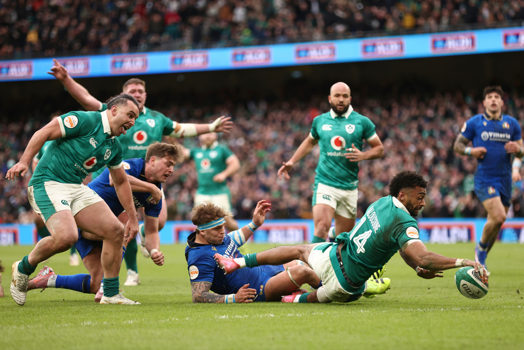Ireland's Robert Baloucoune, goes over the line to score a try during a Six Nations rugby union match between Ireland and Italy in Dublin, Ireland, Saturday, Feb. 14, 2026. (AP Photo/Peter Morrison)