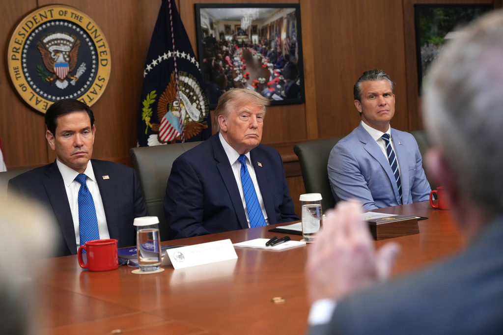 Secretary of State Marco Rubio, from left, President Donald Trump and Defense Secretary Pete Hegseth listen as Health and Human Services Secretary Robert F. Kennedy Jr. speaks during a cabinet meeting, Friday, July 31, 2026, at Camp David, the presidential retreat, near Thurmont, Md., Friday, July 31, 2026. (AP Photo/Jacquelyn Martin)