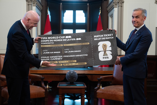 Canada Prime Minister Mark Carney, right, is presented with a novelty World Cup ticket by FIFA President Gianni Infantino on Parliament Hill in Ottawa, Ontario, Friday, Oct. 10, 2025. (Adrian Wyld/The Canadian Press via AP) Canada Prime Minister Mark Carney, right, is presented with a novelty World Cup ticket by FIFA President Gianni Infantino on Parliament Hill in Ottawa, Ontario, Friday, Oct. 10, 2025. (Adrian Wyld/The Canadian Press via AP)