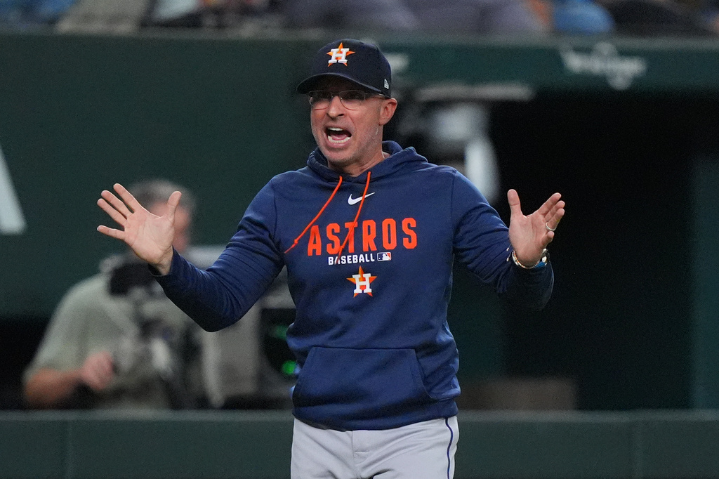 Houston Astros manager Joe Espada questions a call during the fourth inning of a baseball game against the Texas Rangers, Friday, July 10, 2026, in Arlington, Texas. (AP Photo/LM Otero)