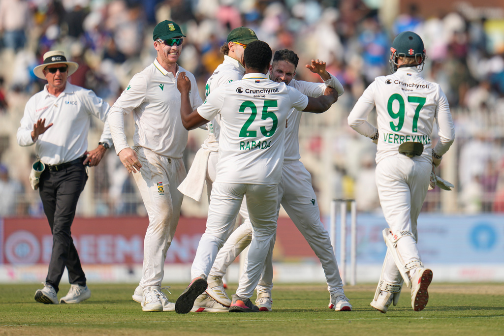 South Africa players celebrate after their win on the third day of the first cricket test match against India in Kolkata, India, Sunday, Nov. 16, 2025. (AP Photo/Aijaz Rahi)
