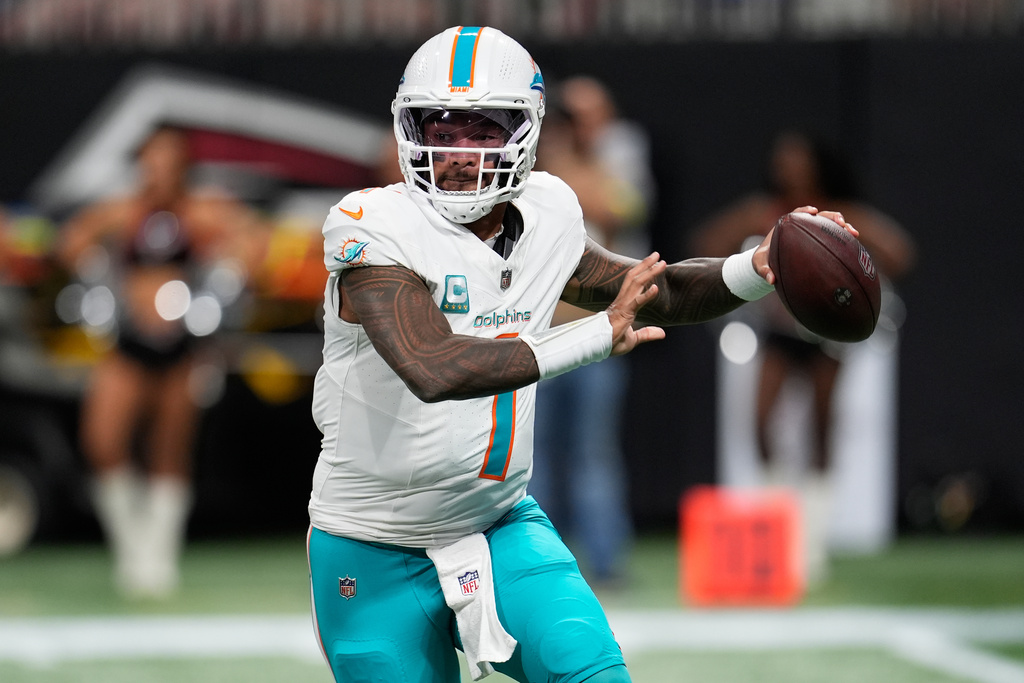 Miami Dolphins quarterback Tua Tagovailoa (1) looks to pass during the first half of an NFL football game against the Atlanta Falcons, Sunday, Oct. 26, 2025, in Atlanta. (AP Photo/Mike Stewart)