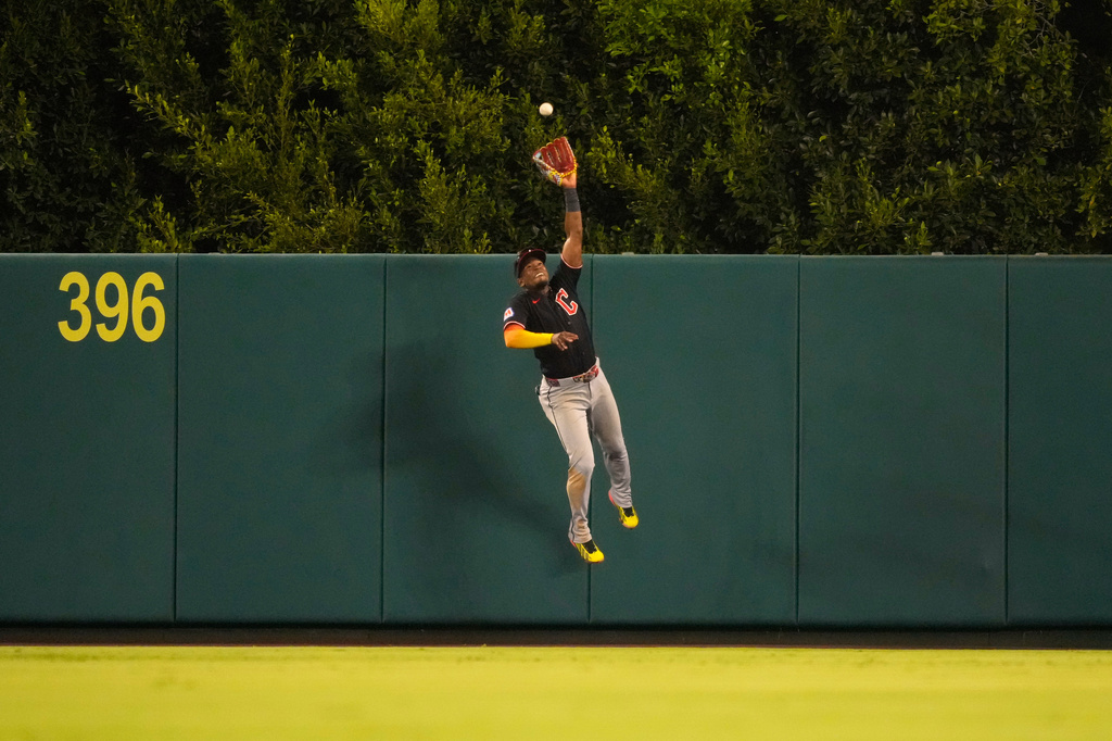 Cleveland Guardians left fielder Angel Martínez makes a catch on a ball hit by Los Angeles Angels' Mike Trout during the eighth inning of a baseball game Tuesday, Aug. 25, 2026, in Anaheim, Calif. (AP Photo/Mark J. Terrill)