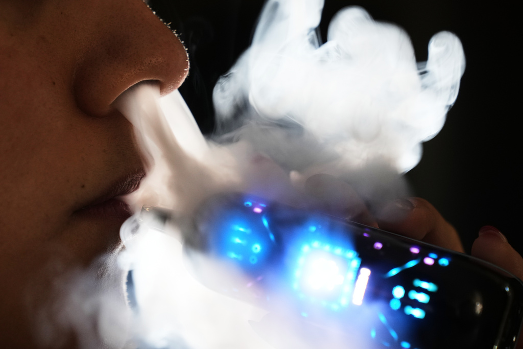 Ximena Fernandez vapes while working remotely from home in Mexico City, Friday, Jan. 30, 2026. (AP Photo/Marco Ugarte)