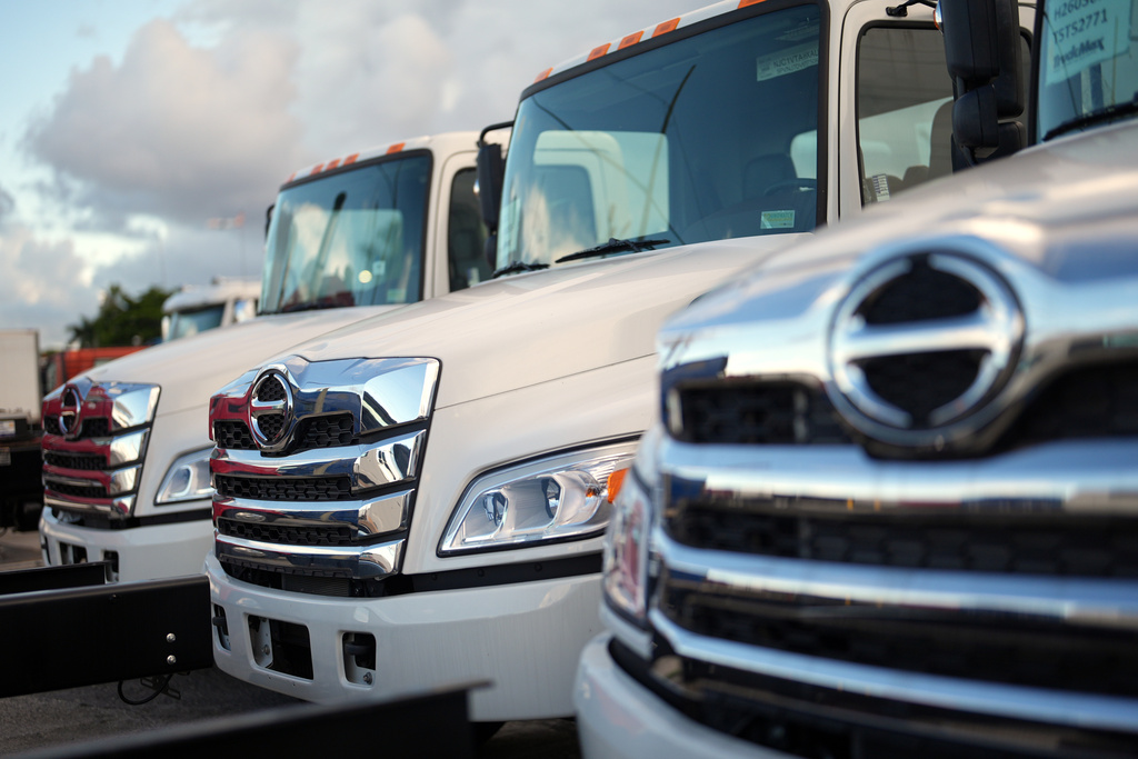 Hino trucks sit on the lot at a truck dealership in Miami, Friday, Sept. 26, 2025. (AP Photo/Rebecca Blackwell)