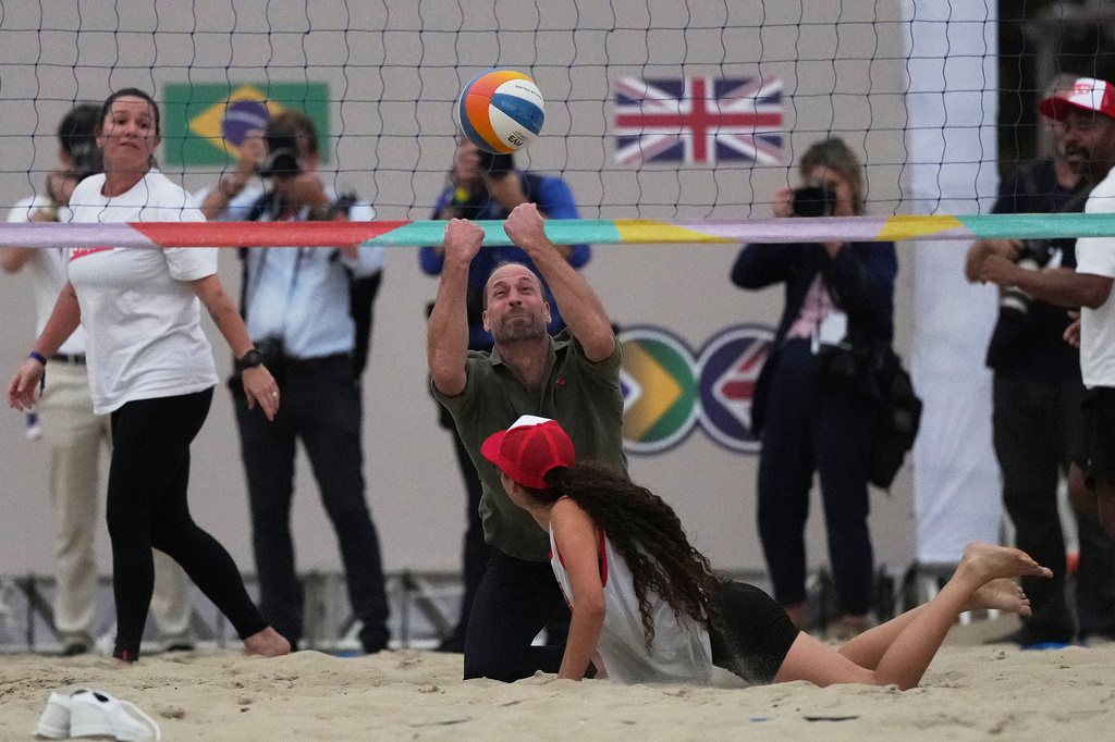 FILE - Prince William plays beach volleyball on Copacabana beach as part of his visit to promote his Earthshot Prize, an initiative to find solutions to major environmental issues, in Rio de Janeiro, Nov. 3, 2025. (AP Photo/Silvia Izquierdo, File)
