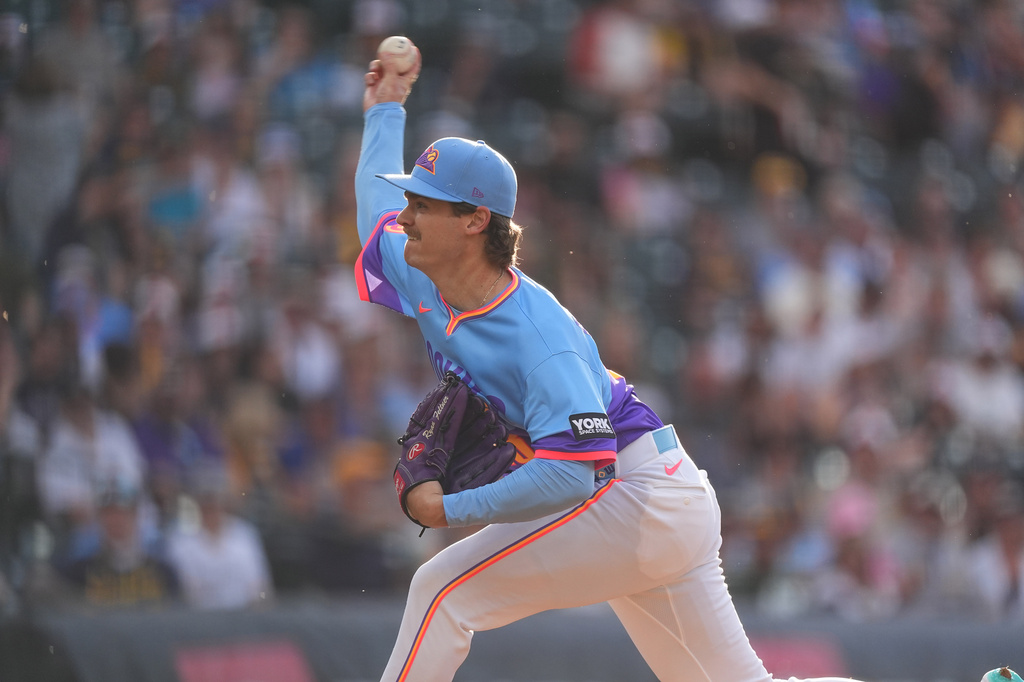 Colorado Rockies starting pitcher Ryan Feltner works against the Milwaukee Brewers in the first inning of a baseball game Friday, June 5, 2026, in Denver. (AP Photo/David Zalubowski)