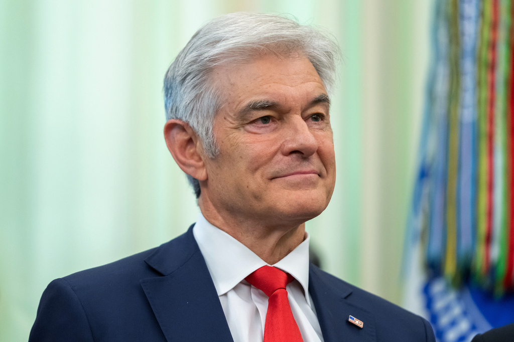 Centers for Medicare & Medicaid Services administrator Dr. Mehmet Oz attends an event on health care affordability in the Oval Office at the White House, Thursday, April 23, 2026, in Washington. (AP Photo/Mark Schiefelbein)